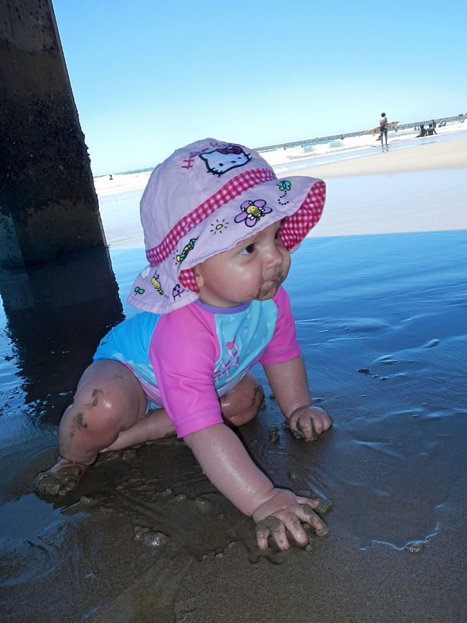 Emma exploring the beach