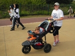 Sharon pushing Emma on the Big Walk